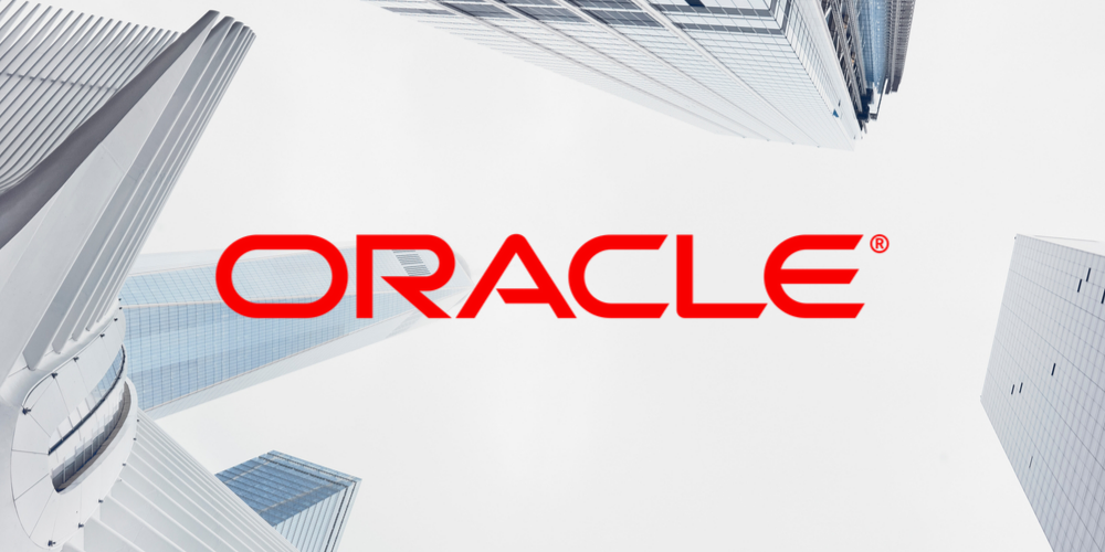worm's eye view of a landscape of buildings with the Oracle logo in the centre of the page 